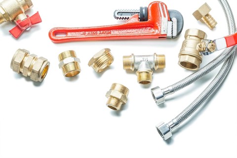 Pipe fottings fixtures and water hoses adjustable wrench isolated on white