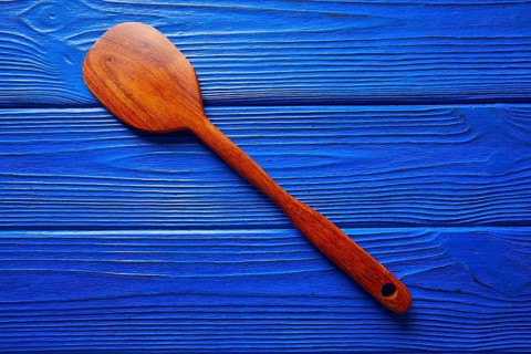 Chef tool spatula on a blue wooden background