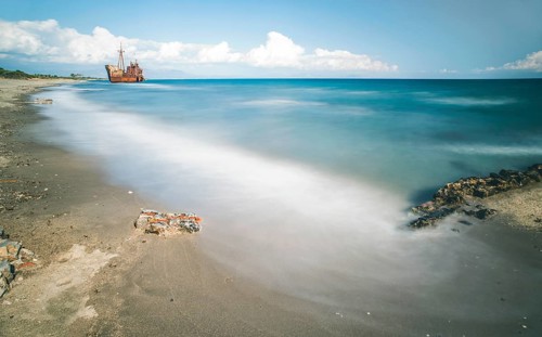 Old rustic big ship. Blue sky