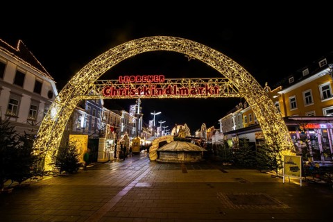 Archway, illuminated entrance to the Christmas market, night shot, main square of Leoben, Styria,