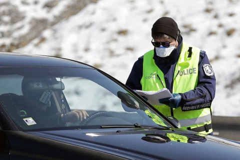 Sofia, Bulgaria - 3 April, 2020: A police officer checks a car drriver at one of the exits of
