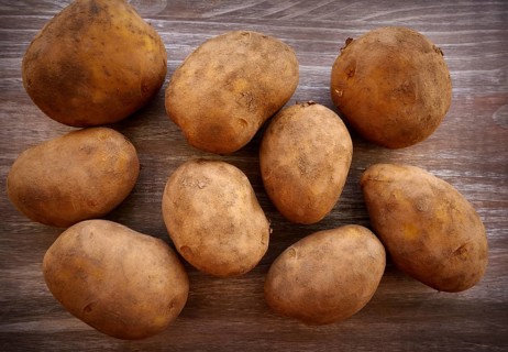 Organic potatoes on a wooden board