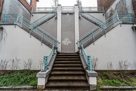 Belgium, 03 15 2019: The symmetric diagonal staircase of the dead end Auguste Snieder street with a