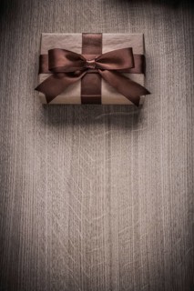 Wrapped vintage giftbox with brown ribbon celebration concept