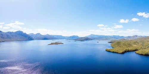 Lake Burbury and surrounding mountain landscape on a warm summer's aftenoon near Queenstown in