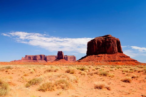 Very hot day in Monument Valley - Iconic peaks of rock formations in the Navajo Park, Utah