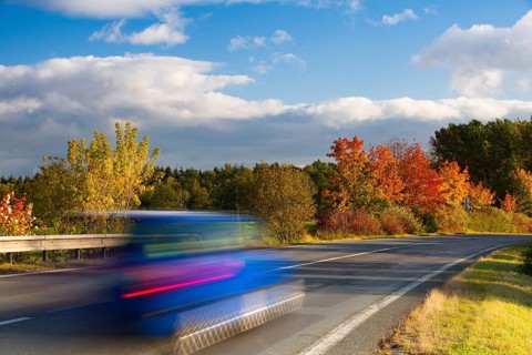 Speed car on a road in Krkonose mountain, Czech Republic, Europe