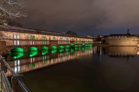 The Vauban dam illuminated at night during Christmas. Strasbourg. Bas-Rhin, Alsace, Grand Est,