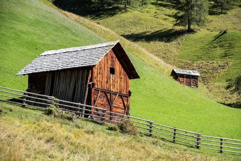 An old wooden hay shed in Val di Morins, the Dolomite Alps of South Tirol