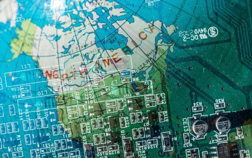 Double exposure technology background and world map. Motherboard