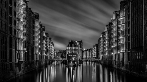 The moated castle in the Speicherstadt photographed from the Poggemühlen Bridge