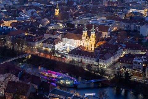 Evening atmosphere, view from the Schlossberg to the illuminated Murinsel and the