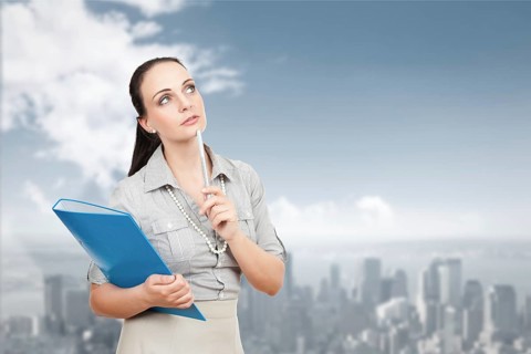 An image of a beautiful business woman in front of the big city