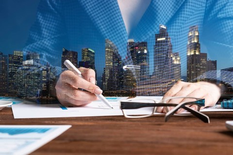 Investment manager analyze financial diagram at wooden desk. Close up woman hand with pen. Strategy