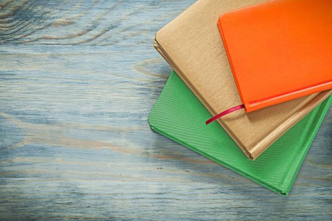 Set of notepads on wooden board education concept