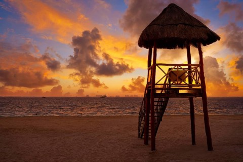 Isla Mujeres island Caribbean beach sunset baywatch tower Riviera Maya Mexico