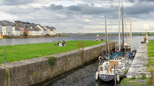 Boat anchored in Eglinton Canal Sea Lock, The Long Walk, Galway, Ireland, United Kingdom, Europe