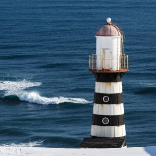 Lighthouse on coast of Pacific Ocean. Russia, Far East, Kamchatka Peninsula,