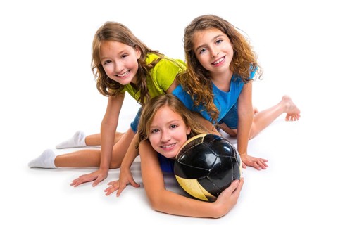 Football soccer girls team portrait with ball on white background