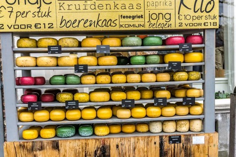 Shop for cheese in the Netherlands with a lot of different round cheeses in different sizes and