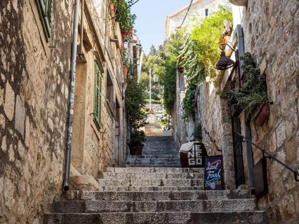 Stone steps, narrow alley in the old town centre, town of Hvar, island of Hvar, Dalmatia, Croatia,
