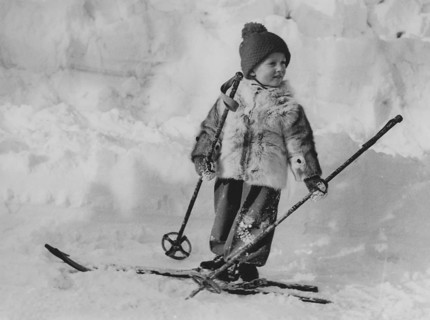 King Harald of Norway. Pictured when being crown prince and a young boy on skis on a winter day.