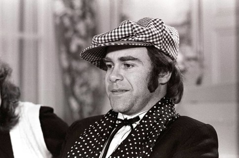 Elton John. English singer, songwriter born march 25 1947. Pictured wearing a chequered cap and a