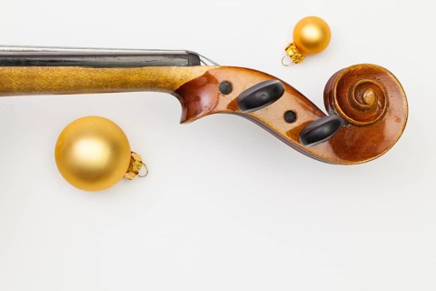 Top view close up shot of old violin and Christmas decoration. Flat Lay Image