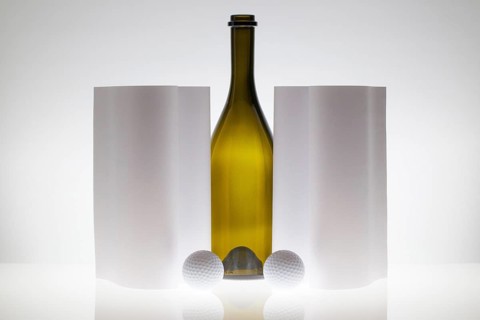 Symmetry abstract Paper Background with glass and golf balls on a glass table