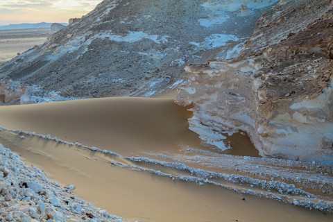 Late afternoon sun casting shadows on rocks in the Libyan desert white desert, Farafra, Egypt,