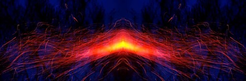 From a glowing hot centre in shades of yellow and orange, bright red trajectories of sparks move