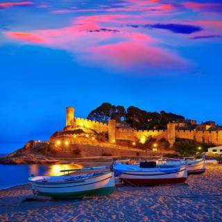 Tossa de Mar sunset in Costa Brava of Catalonia spain Castle and beach