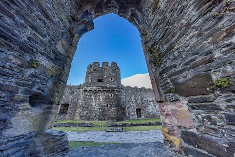 Conwy Castle, view through an arched opening in the castle wall to the tower of the medieval castle