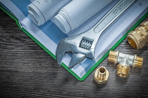 Adjustable spanner plumbing pipe connectors rolled construction plans notebook