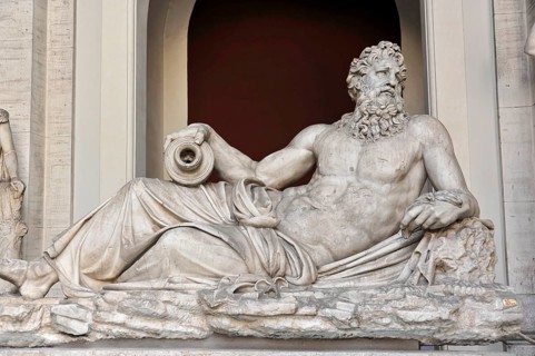Vatican Museums, Vatican, Rome, Italy, Antique marble sculpture of a bearded man in a relaxed