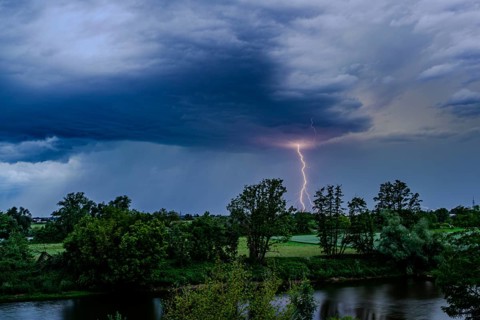 A single bolt of lightning strikes in a dramatic thunderstorm scene with dark clouds, Bogen, Lower