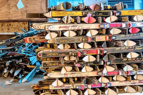 Goesan, South Korea. May 29, 2020: Snow skis from various manufactures stacked in rows in sunlit