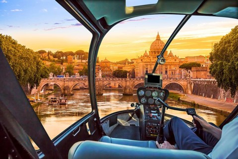 Rome at Sunset with San Pietro basilica, Sant'Angelo bridge and Tevere river in Roma, Italy.