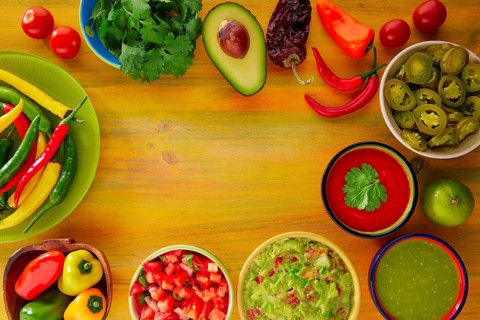 Mexican food mixed guacamole nachos chili sauce dipping cheddar cheese lemon pico de gallo