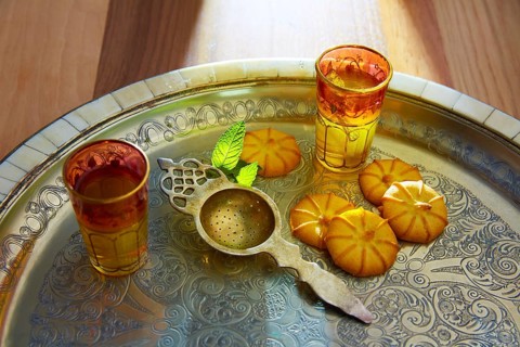 Green tea with mint Moroccan style on silver tray and biscuits