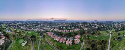 Aerial panoramic view of golf in upscale residential neighborhood during sunset, Rancho Bernardo,