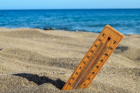 a Thermometer on the Sand Beach