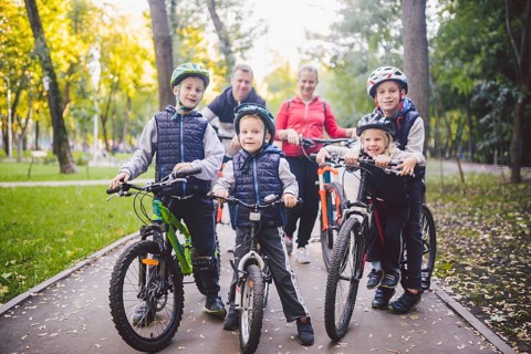 Theme family sports holiday in park in nature. big friendly Caucasian family of six people mountain
