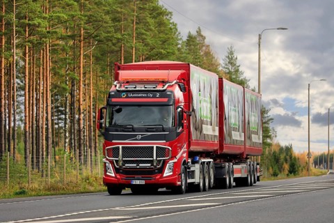 Red Volvo FH of Uusioaines Oy hauling trailer load of Foamit foam glass aggregate along highway 2.