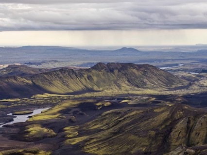 View from Mount Sveinstindur, volcanic landscape, moss-covered hills, mountains, Icelandic