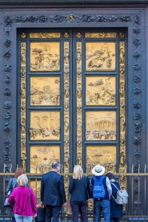 Tourists at the Gates of Paradise at the Baptistery of Saint John in Florence, Italy, Europe