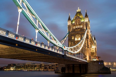 London Tower bridge on sunset illuminated with different colors