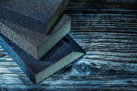 Sanding blocks on vintage wooden board top view