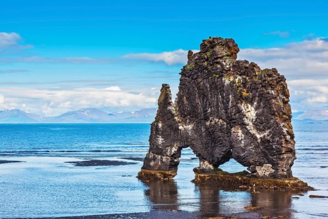 Ancient extinct volcano Hvitserkur on the sea shelf. Stone mammoth Iceland