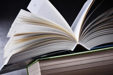 Composition with open book on the table